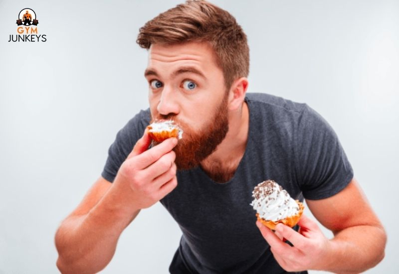 A man eating cupcake(sugar)